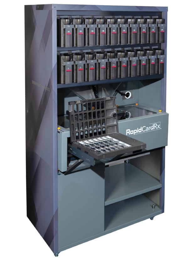 Automated card issuing workstation with a multi-slot card rack and printer labeled RapidCardRx inside a tall cabinet.