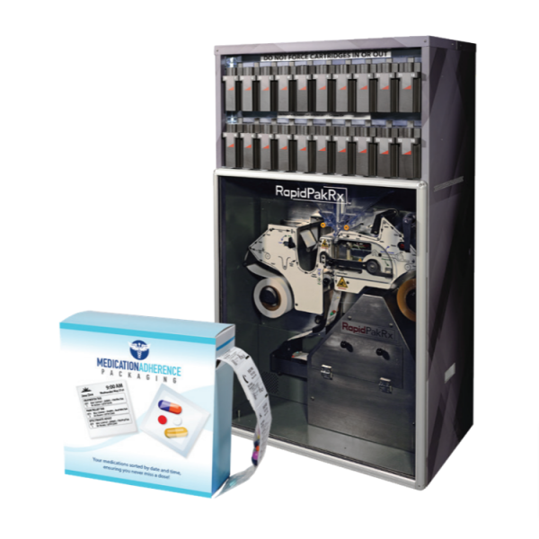 Automated medication packaging machine (RapidPakRx) with a sealed adherence packaging box nearby.